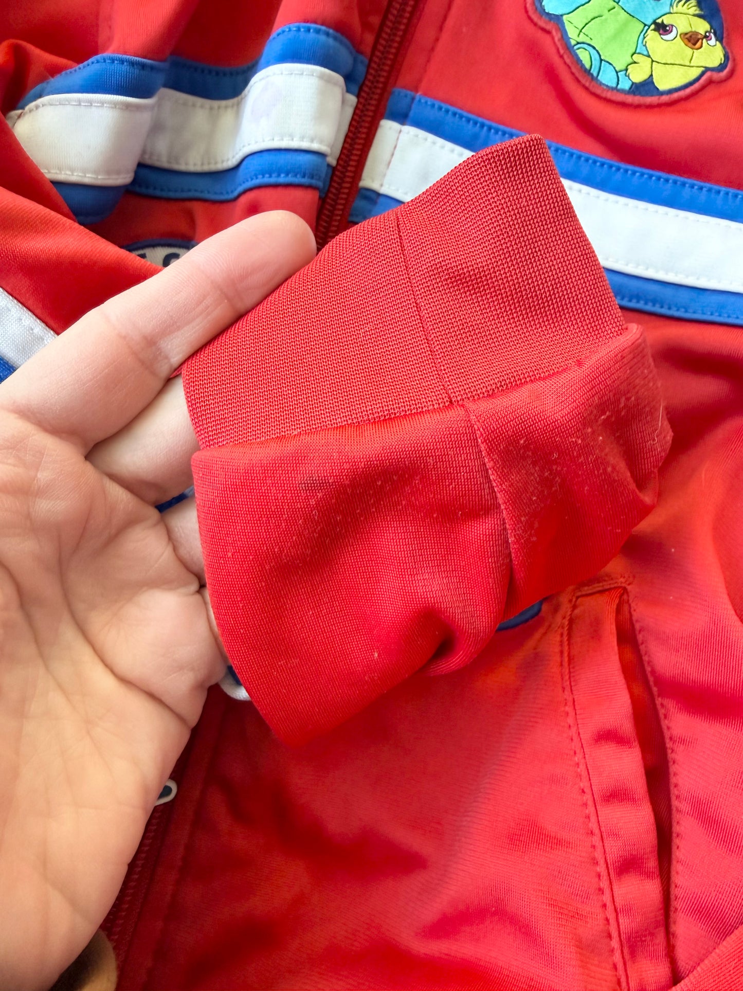 Disney Store Toy Story 4 Red “Toys at Play” Zip Up Sweater (5/6 Years)